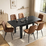 [Black] Extended flip-top dining table with six brown chairs, cup, two glasses and flower vase in a bright dining room.