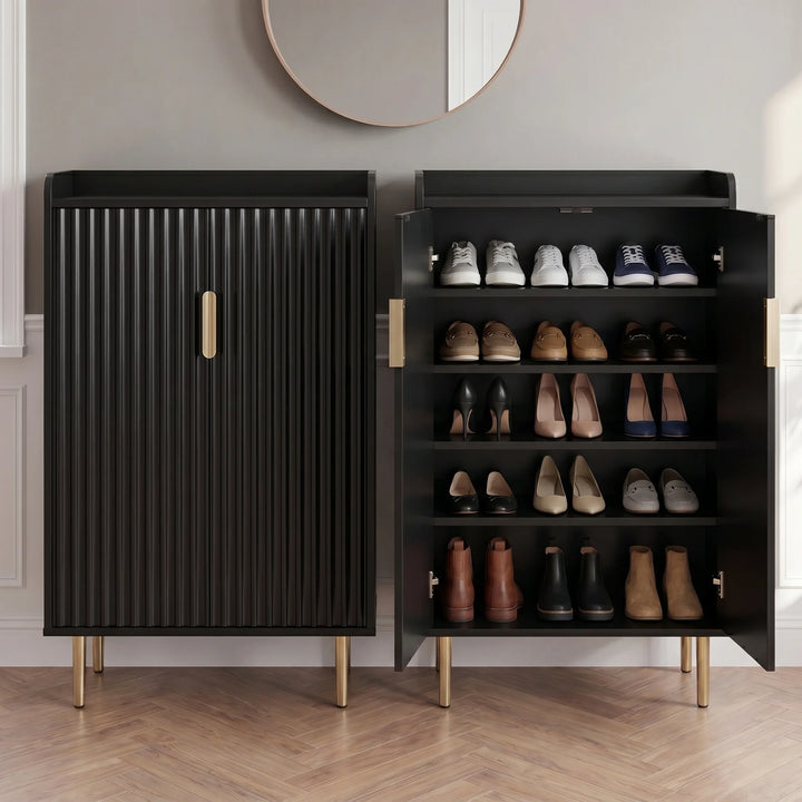 [Black] Fluted Shoe Storage Cabinet shown closed and open side-by-side in a panelled hallway with round mirror and herringbone wood floor