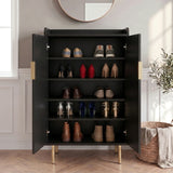 [Black] Fluted Shoe Storage Cabinet with both doors open displaying five shelves of trainers, heels, loafers, and boots in a panelled hallway