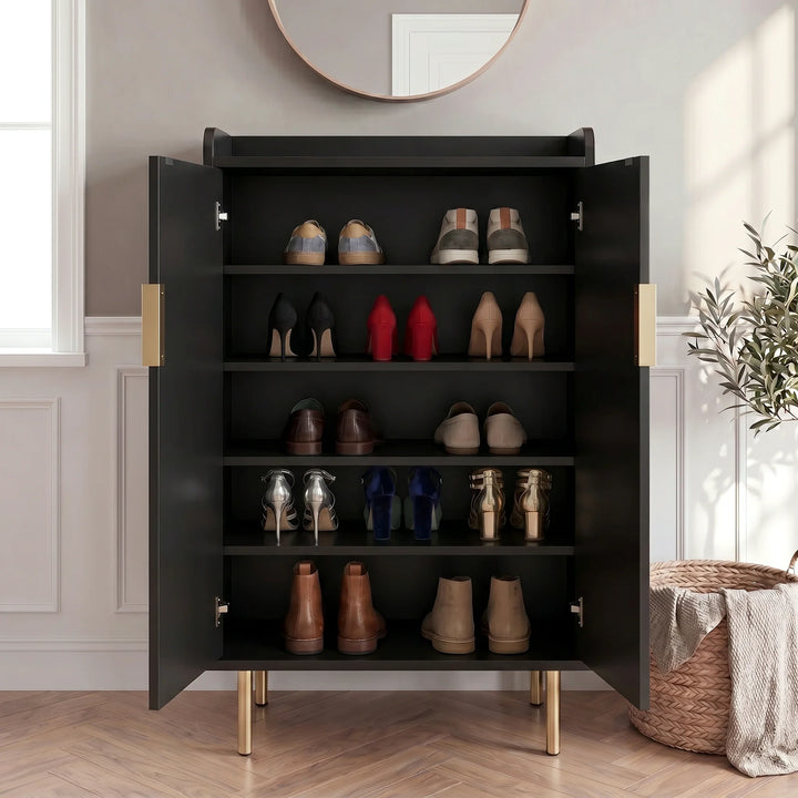 [Black] Fluted Shoe Storage Cabinet with both doors open displaying five shelves of trainers, heels, loafers, and boots in a panelled hallway