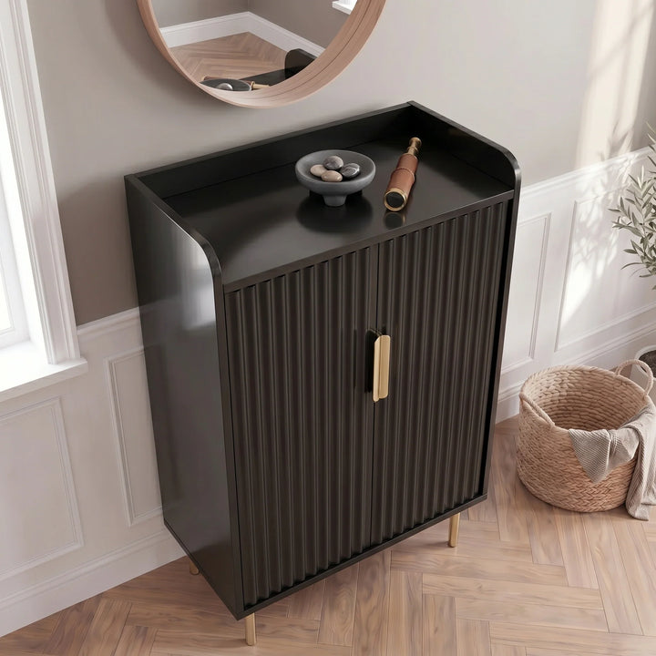 [Black] Fluted Shoe Storage Cabinet aerial view with stone bowl and leather telescope on top, herringbone floor and round mirror behind