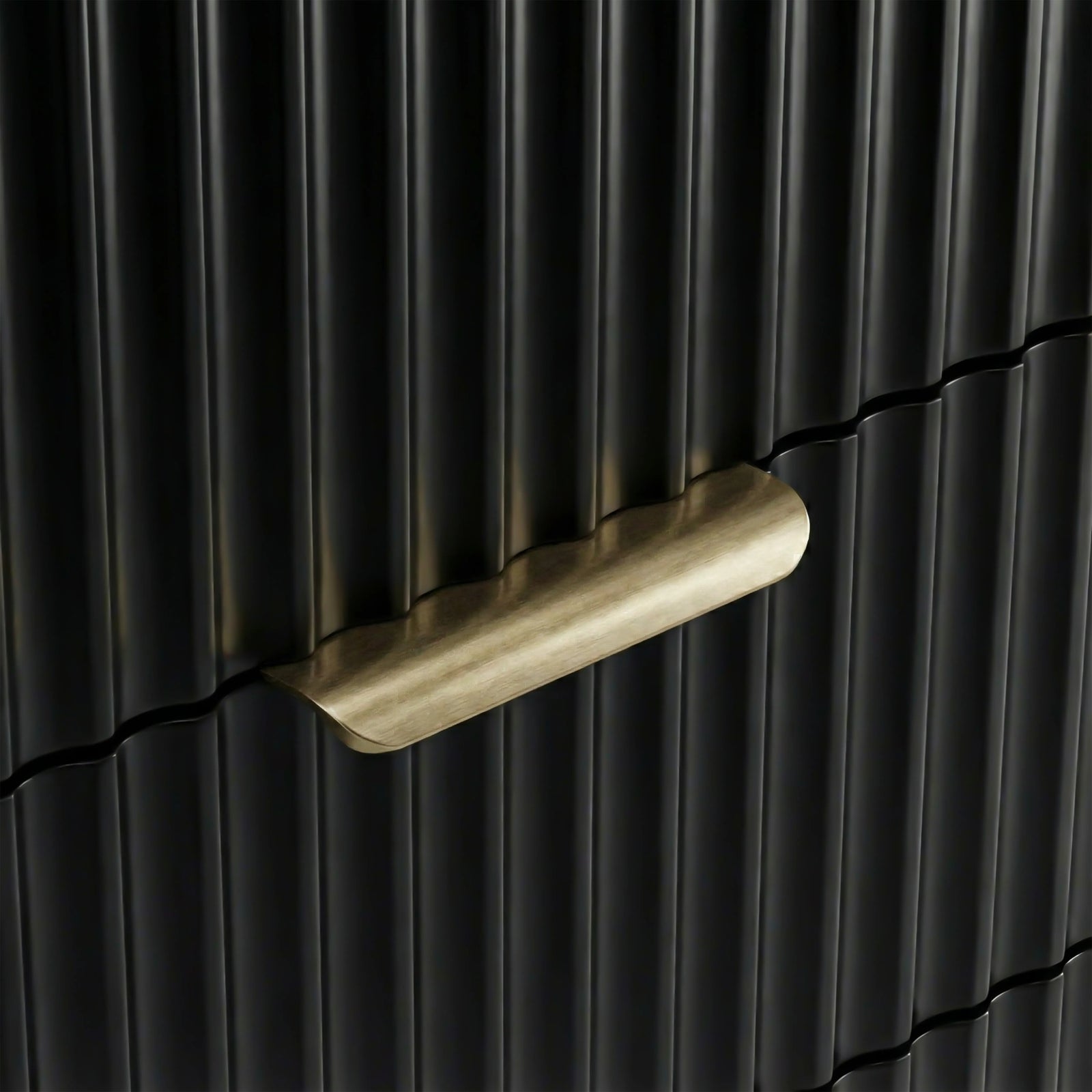 [Black] Close detail of black flutrina panel drawer front with painted metal golden handles and a unique design