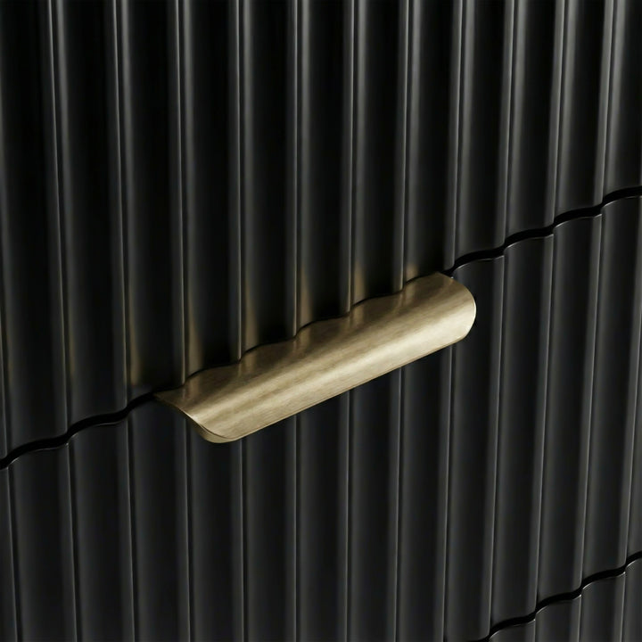 [Black] Close detail of black flutrina panel drawer front with painted metal golden handles and a unique design