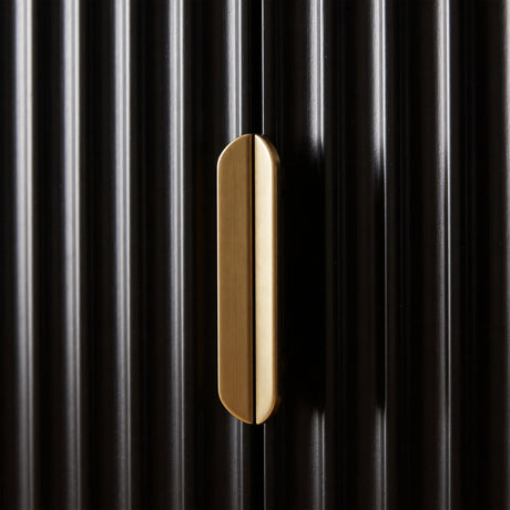 [Black | 60cm] Flutrina close-up of the brushed gold handle centred on the black fluted door panel in natural light