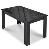 Small black dining table with modern design, perfect for compact spaces.