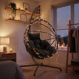 [Black] Hanging egg chair with lights in a cozy room setting