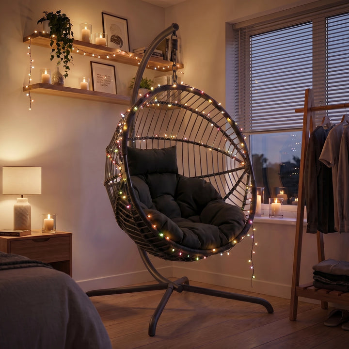 [Black] Hanging egg chair with lights in a cozy room setting