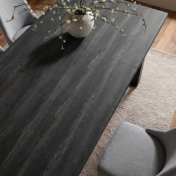 [140cm | Black] 180cm extended dining table top with 40cm centre leaf, black wood grain, grey chairs and blossom vase.