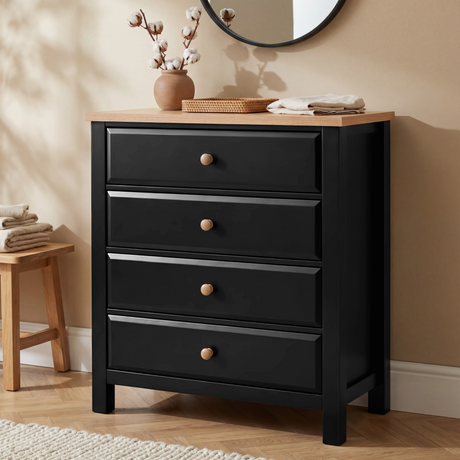 [Black] Haven 4 drawer chest with oak top styled with cotton stems and a wicker tray in a softly lit neutral room