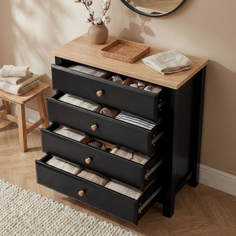 [Black] Haven 4 drawer chest with all four drawers open showing organised folded clothing and accessories inside