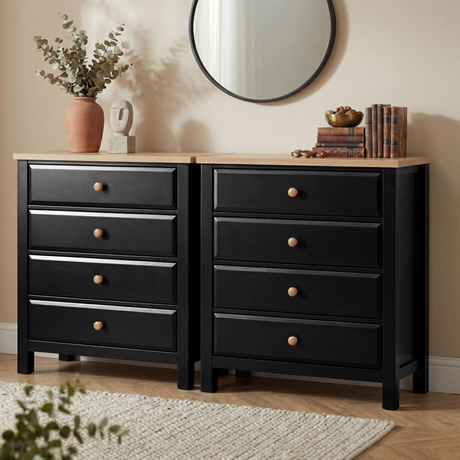 [Black] Haven 4 drawer chest shown as a matching pair side by side, styled with a round mirror and warm accessories