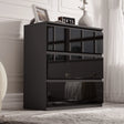 [Black] high gloss 3 drawer chest styled against white panelled wall with vases and clock