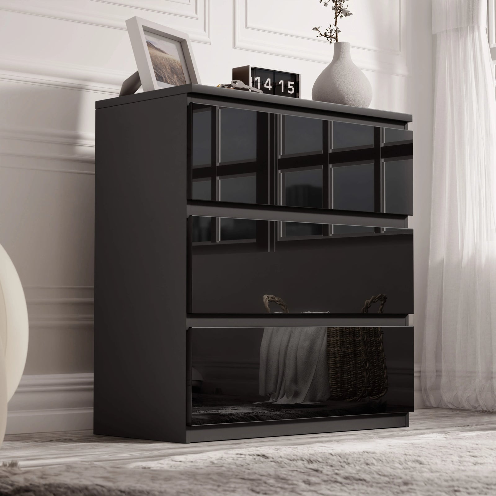 [Black] high gloss 3 drawer chest styled against white panelled wall with vases and clock