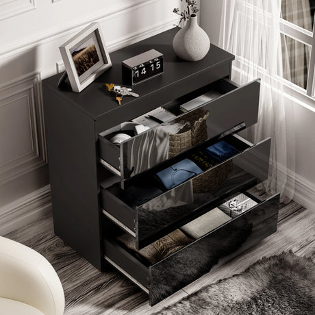[Black] Open drawers of black high gloss chest from the 3 piece bedroom set, showing organized storage for clothing and essentials.
