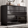 [black] high gloss 8 drawer chest in bedroom with panelled wall mirror and decorative vases