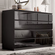 [black] high gloss 8 drawer chest in bedroom with panelled wall mirror and decorative vases