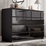 [black] high gloss 8 drawer chest in bedroom with panelled wall mirror and decorative vases