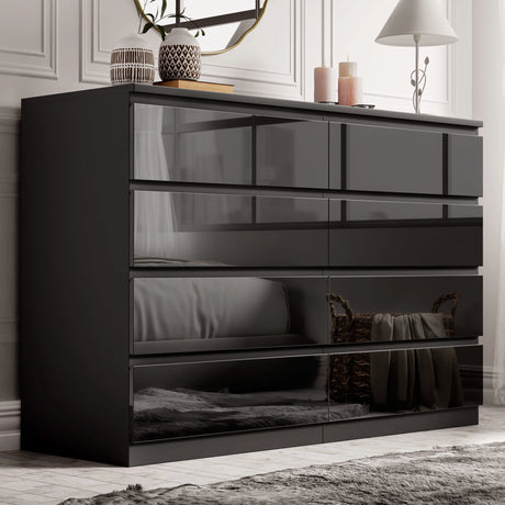 [black] high gloss 8 drawer chest in bedroom with panelled wall mirror and decorative vases
