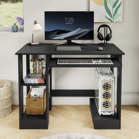 Home office computer desk with shelves in black, featuring a keyboard tray, monitor, and side storage for books and accessories. Ideal for compact workspaces.