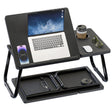 black laptop table with raised top holding a laptop and a drink in the cup holder, shown fully opened and folded