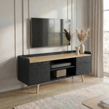 [Black | 112 cm] Larvik styled in a neutral panelled living room with wall-mounted TV, pampas grass, and woven speaker on open shelf