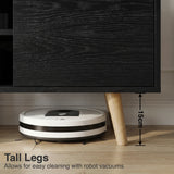 [Black | 112 cm] Larvik close-up of 15cm tapered oak legs with robot vacuum passing underneath on wooden floor