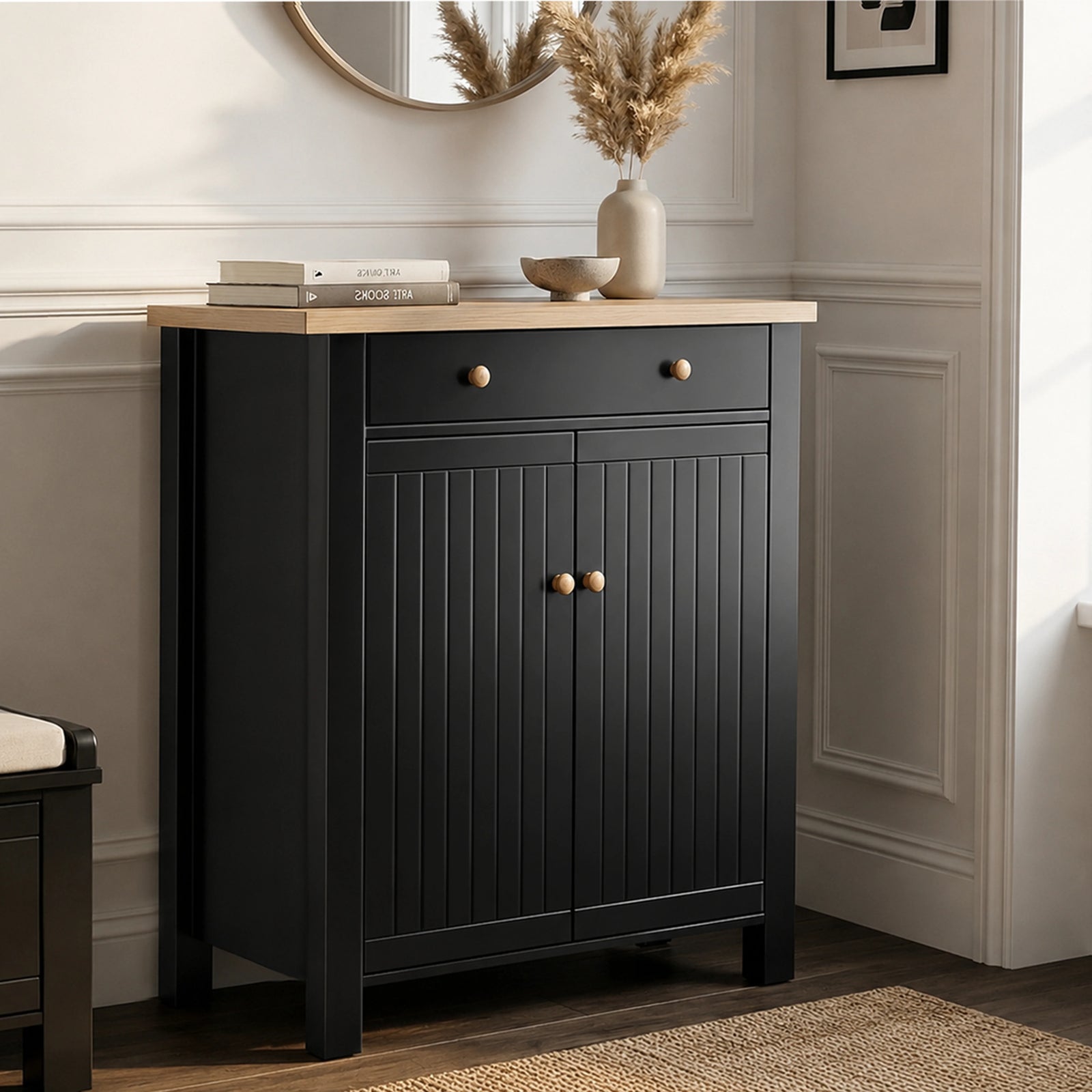 [Black] Linra shoe storage cabinet in black with oak top, top drawer with round knobs, and beadboard double-door cupboard below