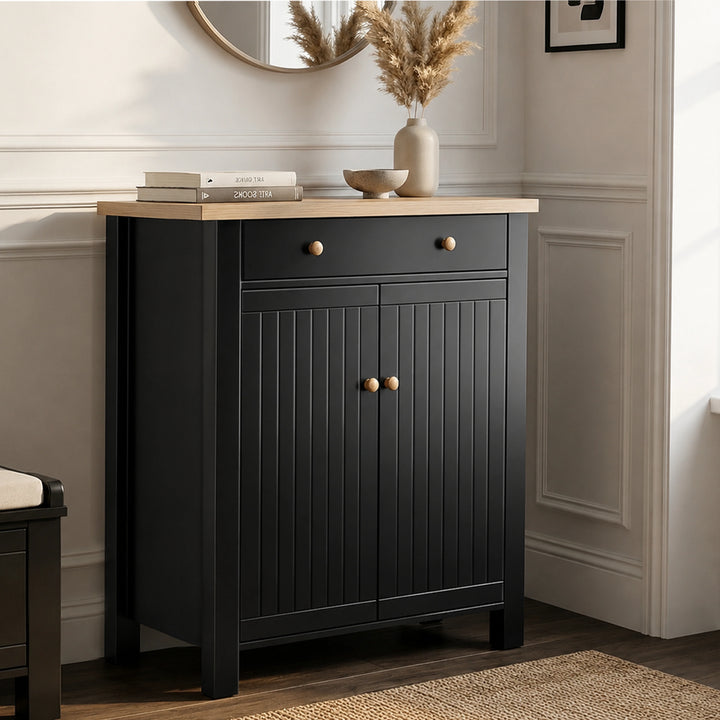 [Black] Linra shoe storage cabinet in black with oak top, top drawer with round knobs, and beadboard double-door cupboard below