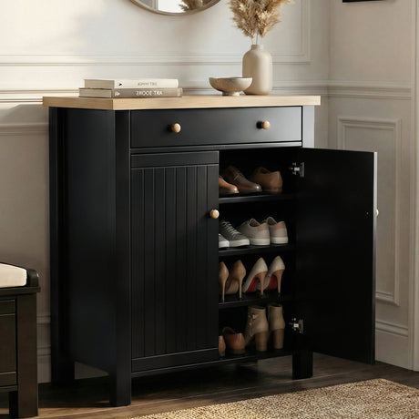 [Black] Linra shoe cabinet with right door open showing three shelves holding oxfords, trainers, and heels in a hallway