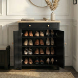 [Black] Linra shoe cabinet fully open showing four shelves filled with loafers, heels, and oxfords in a panelled hallway