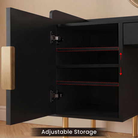 Open cabinet of a black dressing table highlighting adjustable storage shelves and elegant gold handle and leg details