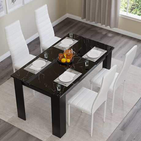 top view of dining table and 4 chairs set in white leather, with a reflective black marble finish tabletop