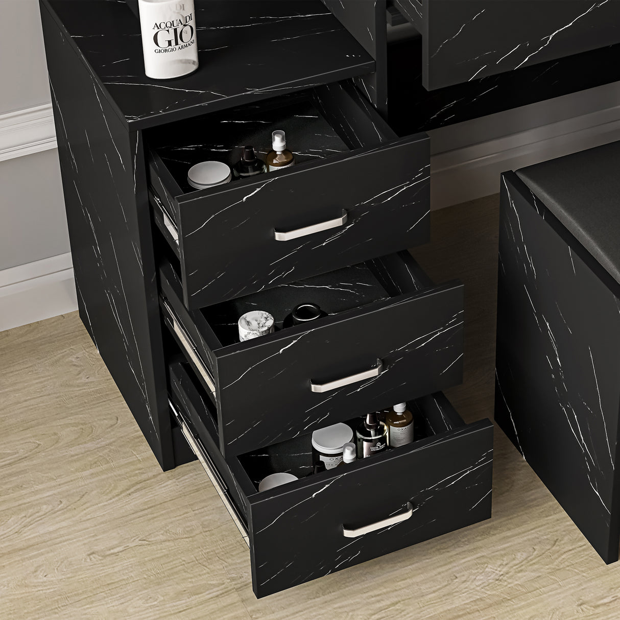 Black marble dressing table with multiple drawers, mirror, and built-in lights for enhanced styling.