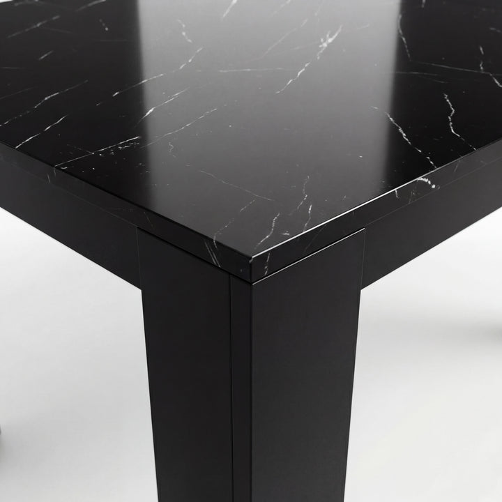 [Black Marble] Close-up of the glossy marble-effect tabletop corner; white veining runs above a thick black L-shaped leg.