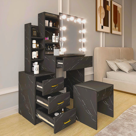 Black marble-patterned vanity with mirror and drawers in a room with a sofa and decor.