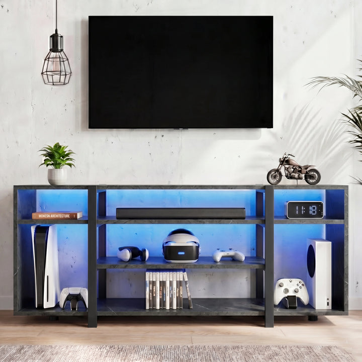 [Black Marble] Zelumi TV stand front-facing in a styled living space with blue LED shelves, gaming consoles, soundbar, and decorative items on top