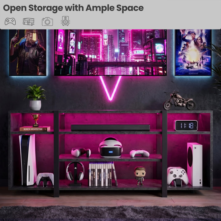 [Black Marble] Zelumi TV stand in a dark gaming setup with pink LED lighting, consoles, VR headset, soundbar, and gaming posters on the wall