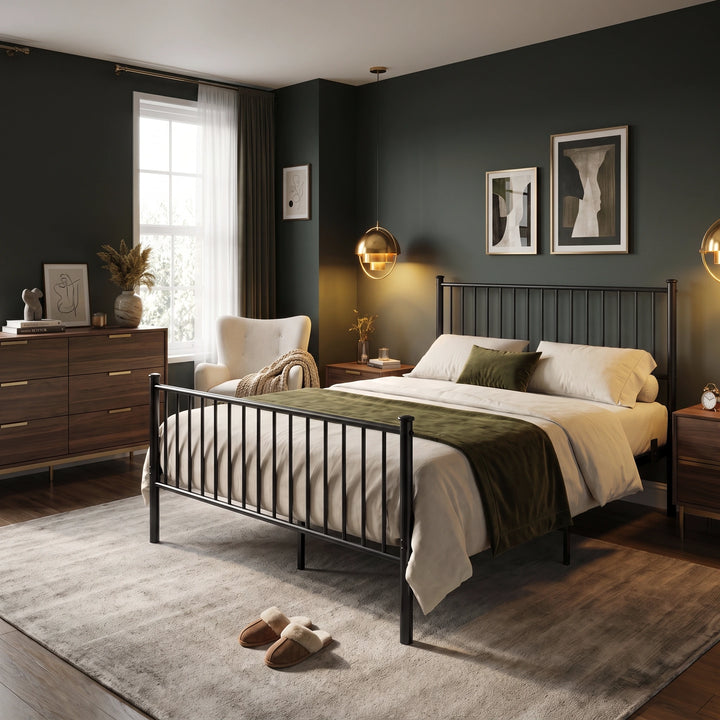 [Black | King] bedroom scene showing a metal bed, cream bedding, olive throw, an armchair, dresser, and gold pendants.