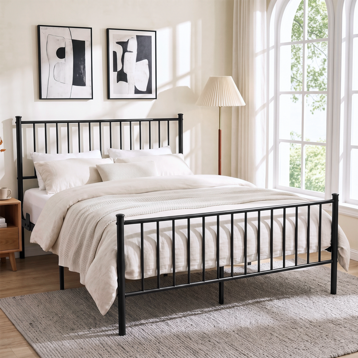 [Black | Double] Angled black metal bed view with cream bedding, tall bar headboard, matching footboard & centre support legs