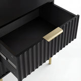 Interior compartment of black painted drawer showing smooth storage finish with golden sleek metal handles