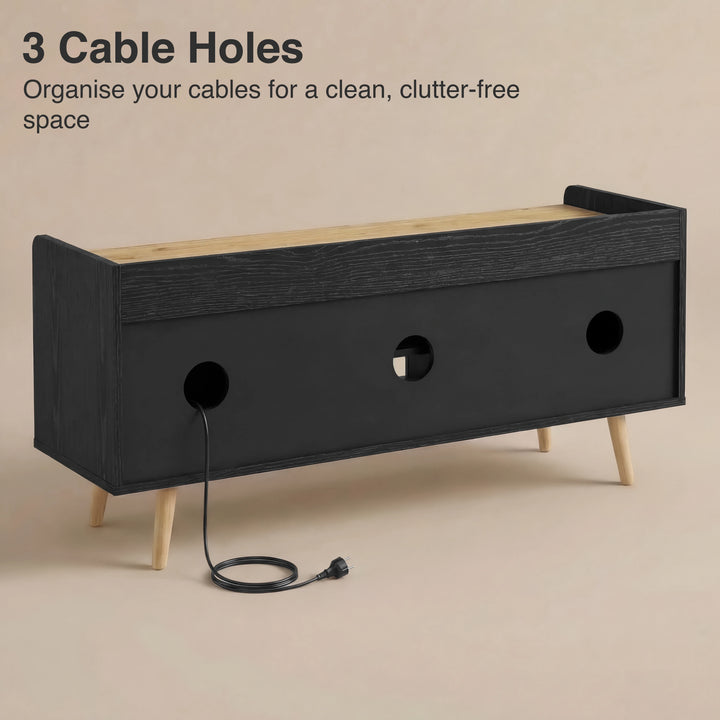 [Black] Larvik TV unit rear panel view with three circular cable holes and a black power cord through centre