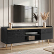 [Black] Larvik TV unit in lifestyle scene with pampas vase, books and basket inside centre cubby of low cabinet