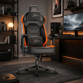 [Black + Orange] gaming chair with the Xstriker logo on the headrest, backrest, and lumbar support, positioned in a modern, dimly lit home office setup.