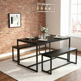 [Black] Orvak dining table and two benches in an industrial brick-wall dining room with place settings and a white rose centrepiece