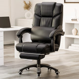 black leather office chair with footrest and lumbar pillow placed beside a wooden desk in home office