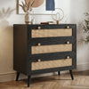 [Black] Rattan chest of drawers angled view showing three rattan-front drawers with wooden knobs on herringbone floor