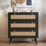 [Black] Rattan chest of drawers straight-on front view with three full-width rattan panels and round wooden knobs
