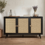 [Black] Rattan three-door sideboard front view with woven panels, round wooden knobs, and tapered black legs
