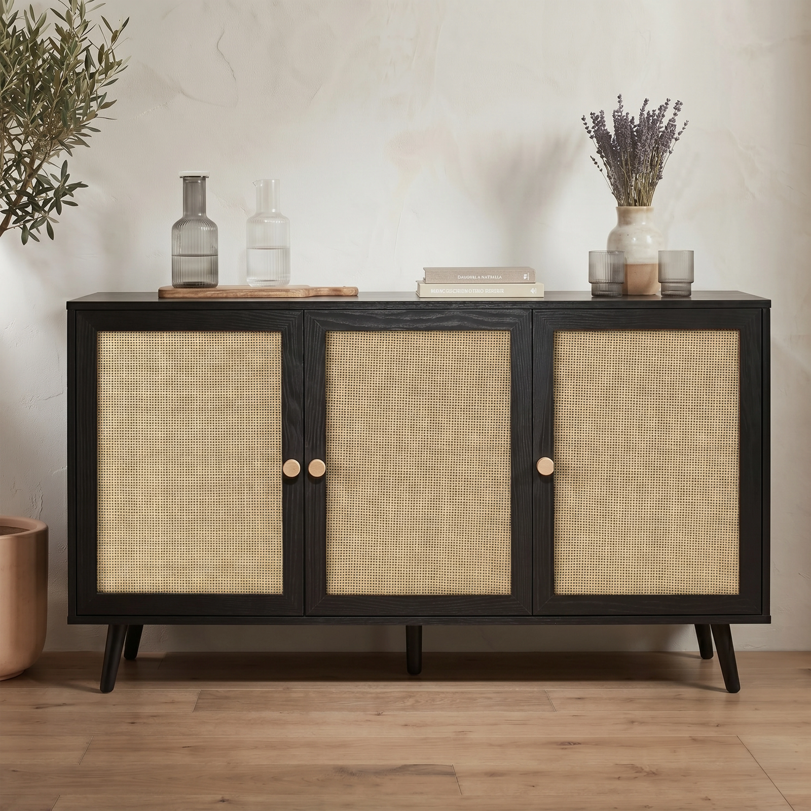 [Black] Rattan three-door sideboard front view with woven panels, round wooden knobs, and tapered black legs

