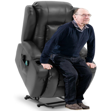 Elderly man using black riser recliner chair in lift mode. Designed for seniors needing mobility support and comfort.